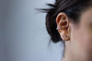 side view of woman's ear with jewellery