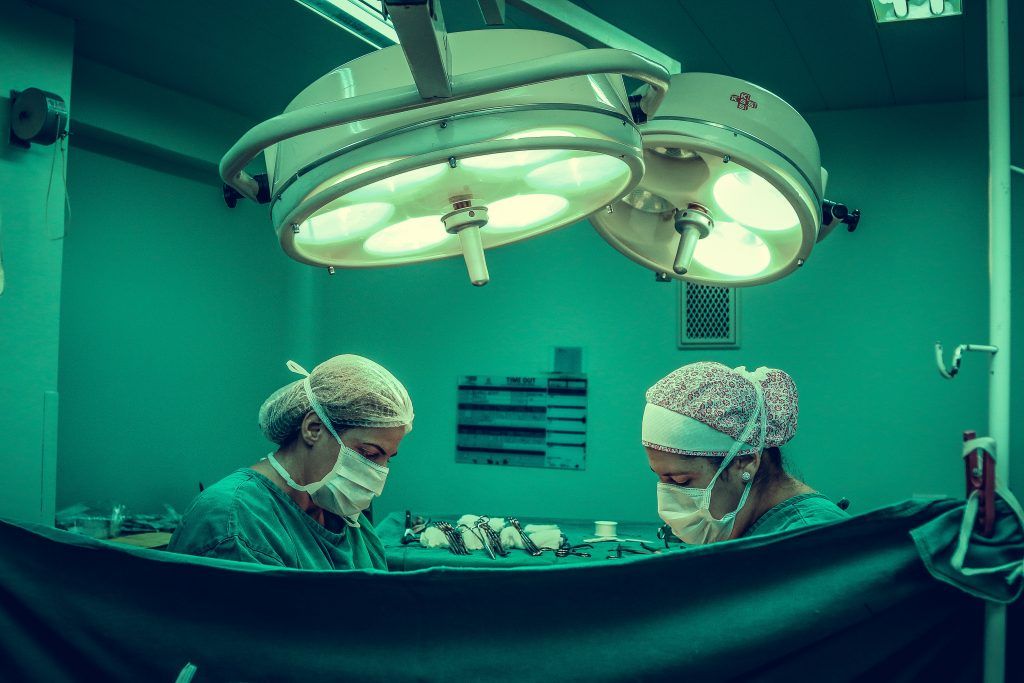two surgeons doing surgery
