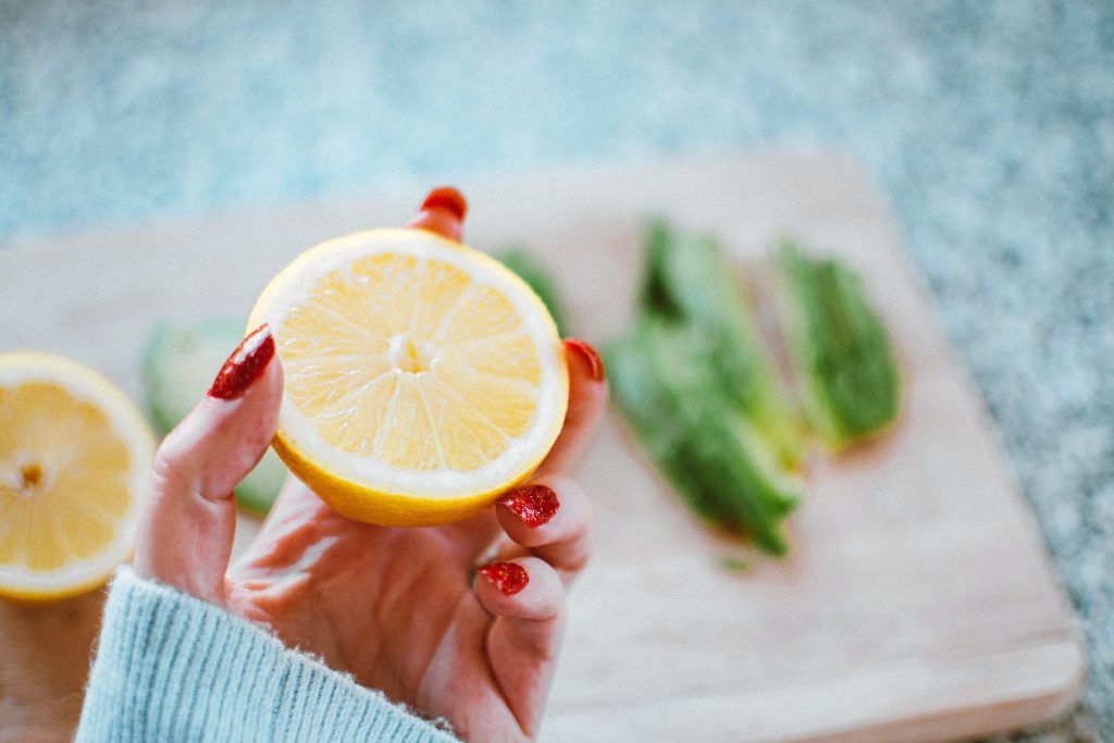 woman holding an orange